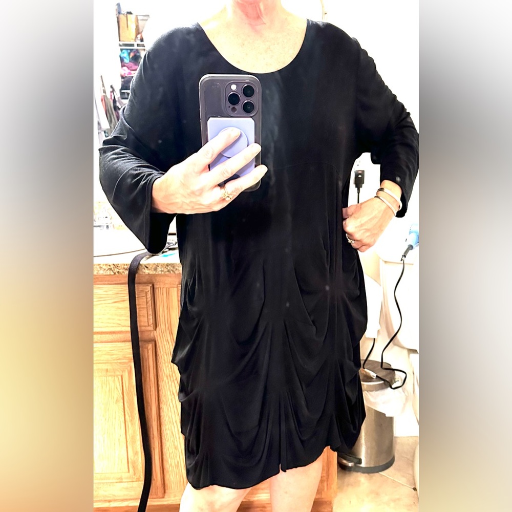 Transparent knit dress with soft flowing tucks